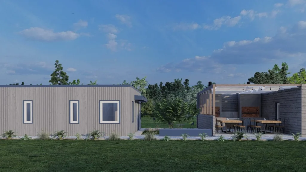 Cabaña con revestimiento de sidding y quincho